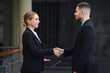 © เลิศลักษณ์ ทิพชัย - group of happy smiling business woman handshake with business man Business mergers and acquisitions image of business people handshake for teamwork