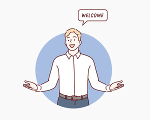 Wall Mural - you are welcome! cheerful business man gesturing welcome sign and smiling while standing against blu