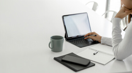 Fototapete - Young woman using digital tablet for online learning at home, mockup blank screen for graphic design.