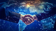 © AspctStyle - Businessman shaking hands with hologram globe map background. Businessman touching technology, global network and data exchange. Generative Ai