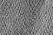 Closeup of fishing net in black and white