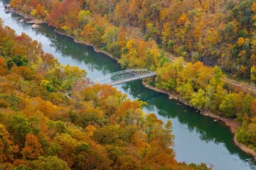 Wall Mural - Aerial view of a colorful autumn landscape with a bridge in New River Gorge National Park