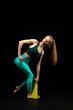 © Ольга Волошко - fitness and yoga girl on a black background