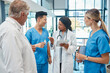 © Oostendorp/peopleimages.com - Healthcare, doctors and nurses talking in a hospital with a tablet for research, planning or schedule. Men and women medical group together for communication strategy, virus or surgery in a hospital