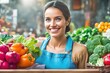 © Pictures Paradise - Portrait of a happy greengrocer standing in front of the vegetables. Happy owner of a nice and beautiful woman in an apron. Grocery. Copy space text.