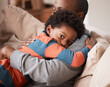 © Haas/peopleimages.com - Love, portrait and boy hugging his father while relaxing on sofa in the living room of their home. Care, safety and scared African child embracing his dad for comfort or bonding in their family house