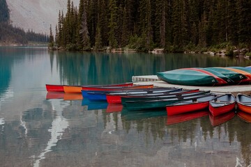 Wall Mural - Moored boats in the Moraine lake in Canada