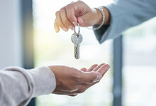 Keys, hands and sale of property, house or real estate investment with realtor and new home. Closeup, hand and key for homeowner buying or renting apartment, building or moving and relocation