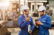 © Quality Stock Arts - Engineer Worker Working Together Talking With Friend Teammate In Metal Factory Training Using Machine Part.