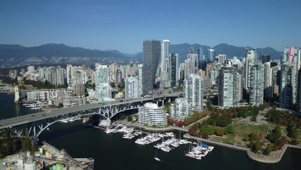 Canvas Print - Aerial view of cars on a bridge on the false creek with Vancouver City buildings