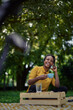 © kerkezz - a beautiful young woman talking on the phone in the park and drinking coffee