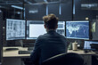 © ADDICTIVE STOCK - Generative AI illustration of the rear view of an anonymous worker with beard sitting watching image on monitor while working in an office