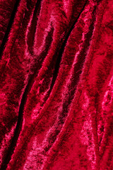 Wall Mural - Texture of red velor corduroy fabric with folds.