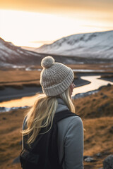 Wall Mural - Girl in beanie traveling and looking out into a landscape at sunset ai generative