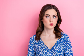 Poster - Portrait of lovely creative lady look empty space pouted lips contemplate isolated on pink color background