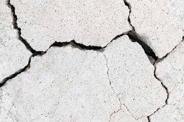 Wall Mural - White porous stone with cracks. Stone texture background. Cracked concrete wall texture