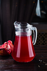 Poster - Freshly berry juice in a glass jar with pomegranate.