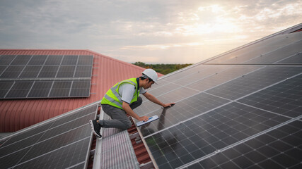 Wall Mural - service engineer checking solar cell on the roof for maintenance if there is a damaged part. enginee