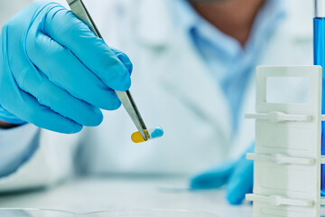 Wall Mural - close up of medical expert working on new medicine in pharmaceutical lab.