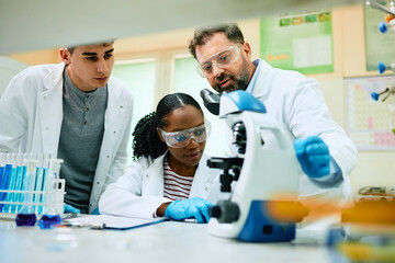 Wall Mural - multiracial team of scientist working on new research in laboratory.