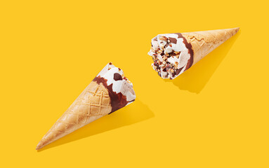 Wall Mural - hazelnut ice cream with cone on yellow pastel background