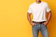© AnaWein - Young man wearing bella canvas white shirt mockup, at yellow background. Design tshirt template, print presentation mock-up. AI generated.