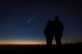 Fototapeta Zwierzęta - silhouette of a couple at night