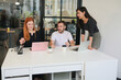 © FotoArtist - Business discussions. Shot of businesswomen brainstorming in an office