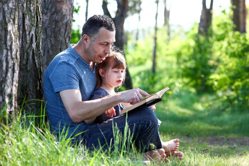 Wall Mural - father and child reading the bible