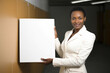 © Anne-Marie Albrecht - Portrait of an african american businesswoman holding a white board