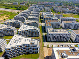 Fototapeta Morze - Aerial view landscape. A drone view of a modern housing development, apartment blocks. Apartments and houses.