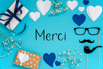 Wall Mural - Blue Flat Lay With Accessories, Gifts, Hearts, Text Merci Means Thank You
