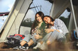 © KL 1981 - Asian couple women, LGBTQ teen couples travel sitting together drinks in camping tent evening time in a romantic nature atmosphere. LGBTQ lesbians, Lesbians girlfriend, Best friend.