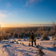 Beautiful Amazing Sunset Winter Mountains. A Man Goes A Sport Hike In Snow Holidays. Christmas Background. Unique Landscape. Mt Lysa, Beskydy Mountains In Czech