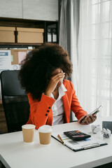 Wall Mural - Tired african american business woman working with audit, balance sheet, investing activities, safety stock, net loss, business risks, accumulated depreciation, factory overhead, accrued expense