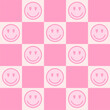 Retro checkerboard groovy seamless pattern with pink smiling faces on pink and white background. 70s 80s style cute geometric vector illustration. Positive vibes. Hippie style aesthetics background.
