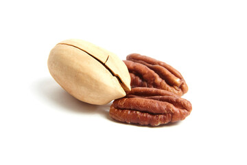 Wall Mural - Pecan nut in shell and peeled pecan seeds isolated on a white. Whole and halves of pecan nut