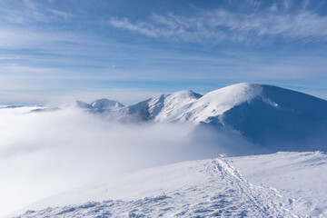 Wall Mural - Winter snow covered mountain peaks in Europe. Great place for winter sports