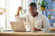 © N Lawrenson/peopleimages.com - Black business man, celebration and laptop with smile, winning or excited for profit, trading or promotion. African businessman, winner and celebrate by computer, gambling or esports in modern office