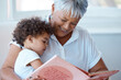 © N Lawrenson/peopleimages.com - Family, girl and grandmother reading a book, story and quality time with happiness, bonding and fairy tale. Granny, female grandchild or kid with fun, literature or learning to read at home and relax