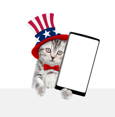 Poster - Cute kitten wearing like Uncle Sam showing big smartphone with white blank screen. isolated on white background