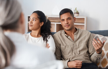 Wall Mural - Angry couple on sofa, therapy and marriage counselling, advice and problem solving in relationship. Stress, man and woman with therapist in conversation, work on healthy communication and healing.