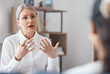 Woman, therapist and consulting patient in mental health, psychology or healthcare counseling. Female person or psychologist talking to client with anxiety, stress or problems in therapy consultation