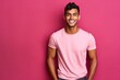 canvas print picture - Photo realistic athletic Indian male model wearing  a t-shirt pink background  generative ai