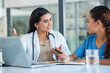 © N Lawrenson/peopleimages.com - Hospital, doctors and women in discussion on laptop for medical analysis, research and internet. Healthcare, clinic and female health workers talking on computer for diagnosis, consulting and service