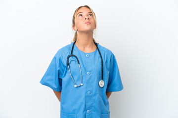 Wall Mural - Little caucasian girl disguised as surgeon isolated on white background and looking up