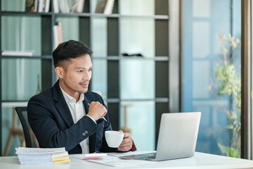 Asian business man working at table office, business finance technology, financial document and business accounting. 