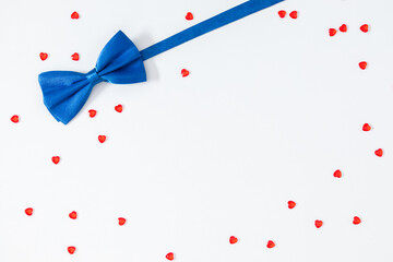 Father's Day concept. Flat lay top view of blue bow ties red heart confetti isolated on white background with space for text or promotion and greeting message, banner