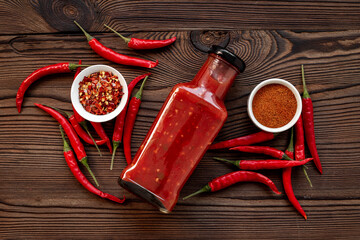 Wall Mural - Spicy chili seasoning and red ripe pepper, top view