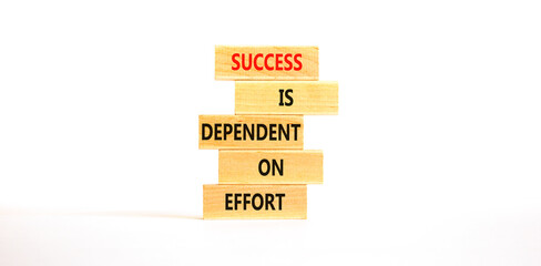 Wall Mural - Success and effort symbol. Concept words Success is dependent on effort on wooden block. Beautiful white table white background. Business success and effort concept. Copy space.